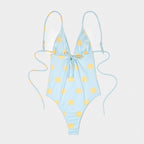 Costume da bagno azzurro con stampa soli gialli